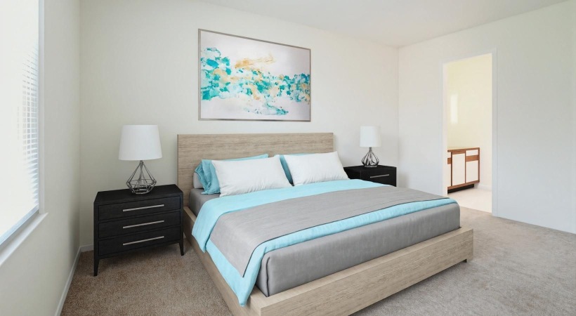 a bedroom with a bed and lamps