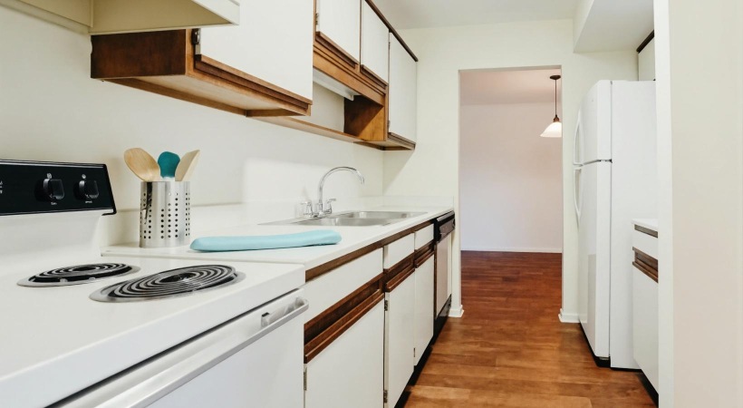 a kitchen with white cabinets