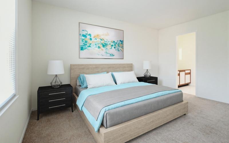 a bedroom with a bed and lamps
